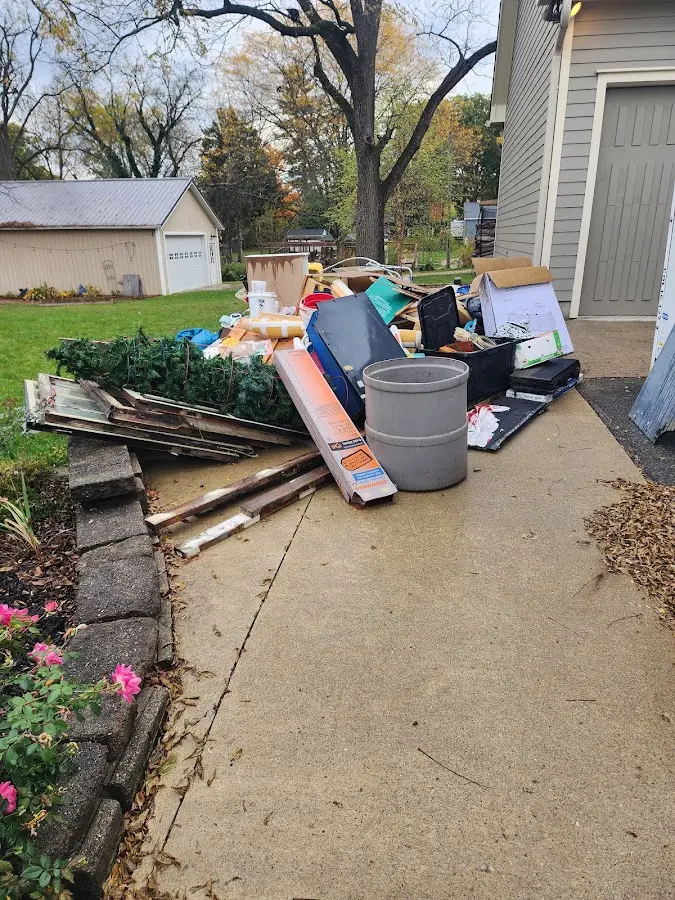 Dumpster being loaded with debris for 10 Yard Dumpster Rental in Marblehead